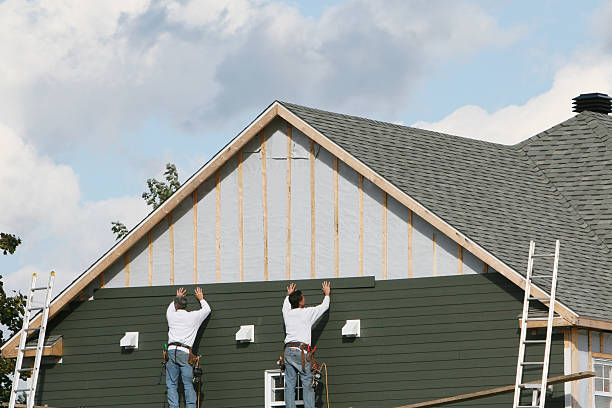 Professional Siding Replacement technician working in Corolla, NC